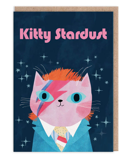 Greeting card featuring a pink cat dressed as David Bowie’s Ziggy Stardust with lightning bolt makeup and a blue suit, designed by Angie Rozelaar. A6 card with kraft envelope, blank inside.