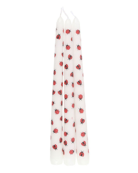 Side view of the pink packaging for the Love Bug Ladybird Taper Candles. The red label says "Set of 3 Love Bug Taper Candles," with heart and ladybird illustrations. A cute and quirky gift for candle lovers.
