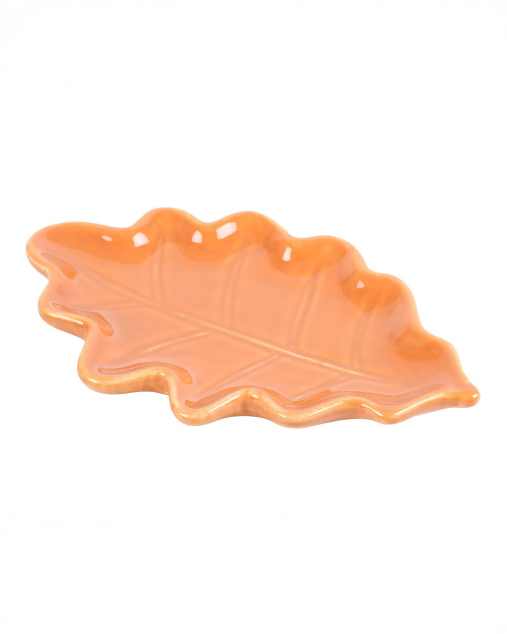 A side view of the Rebel Romance Autumn Leaf Dish, showcasing its raised edges and embossed leaf vein details. The ceramic dish has a natural shape and is ideal for storing small items or adding a cosy autumnal touch to any space.