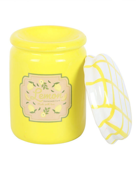 The Rebel Romance lemon curd jar oil burner with its lid off, showing the dish inside for wax melts or essential oils. Its bright yellow design and vintage lemon label bring a playful, millennial-friendly aesthetic to your home.