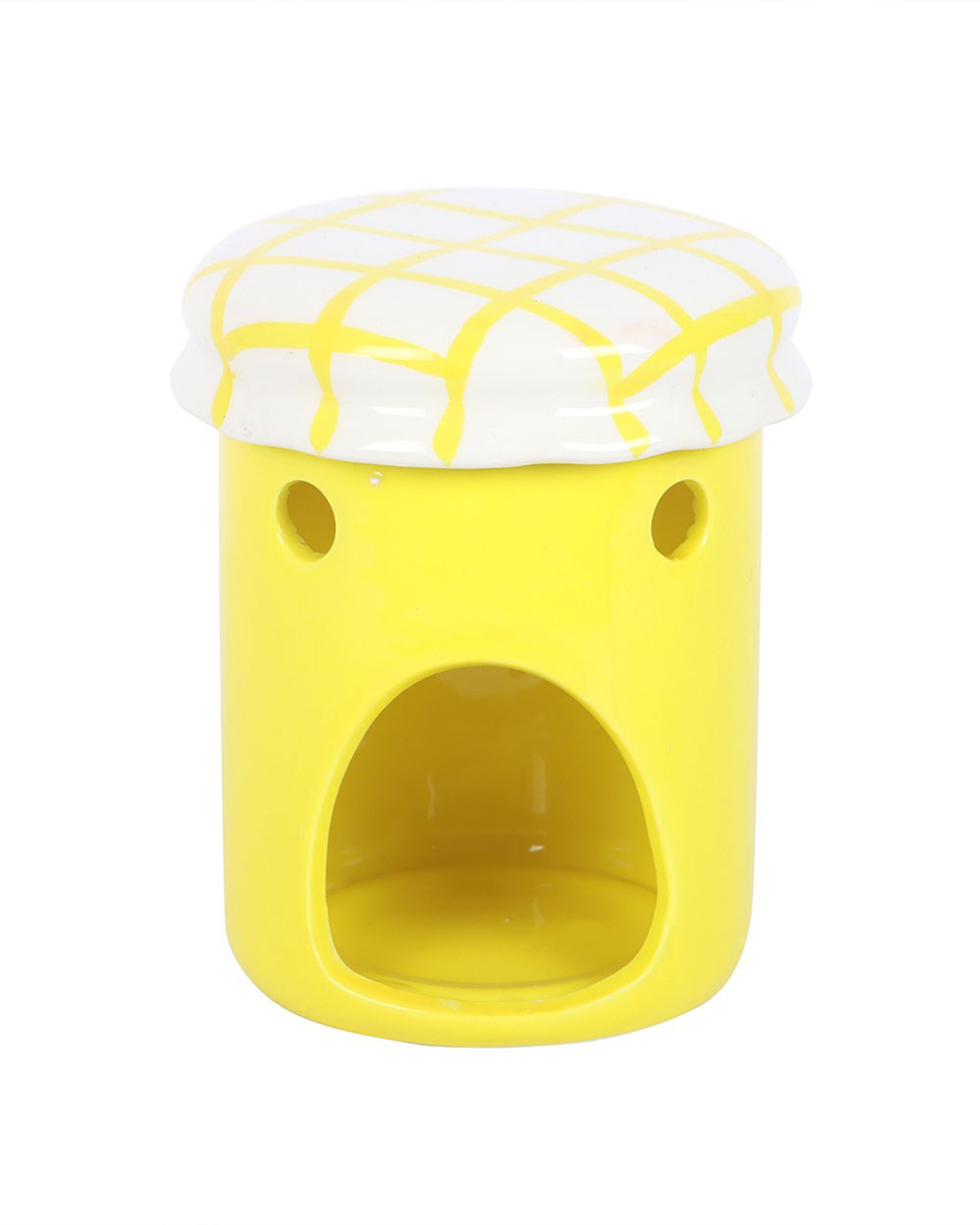 Close-up of the Rebel Romance lemon curd jar oil burner and wax warmer with its lid on, featuring a white top with a yellow criss-cross pattern and a cut-out section at the base for a tealight. Quirky and functional homeware that doubles as a fun décor piece.