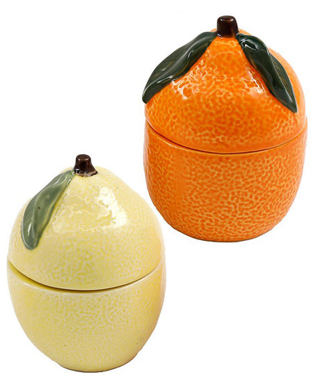 The Lemon and Orange Fruit Candle Set displayed together. Each candle is encased in a ceramic holder shaped like its respective fruit, making them both decorative and functional. Cottagecore style for kitschy and cute homes.