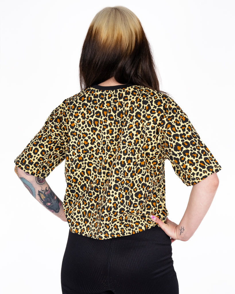 Rear view of Florence wearing the Rebel Romance Classic Leopard Cropped Boxy Tee, showing the boxy fit and striking leopard pattern. This slow fashion piece is part of Rebel Romance’s alt-style clothing collection.