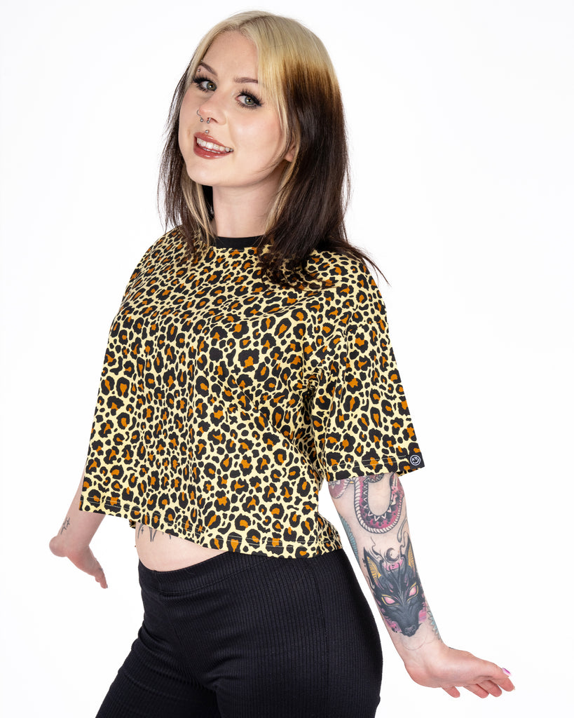 Florence turns slightly to the side in the Rebel Romance Classic Leopard Cropped Boxy Tee, revealing the flattering cropped cut and bold print. A standout piece from Rebel Romance’s expressive ethical fashion line.