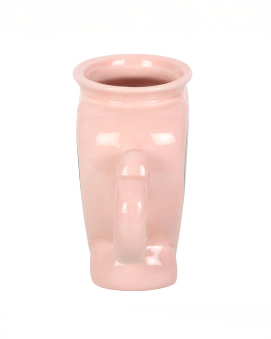 Side view of the Rebel Romance Love Potion Shaped Mug in soft pink ceramic, showing the unique sculpted shape and heart handle. A fun gothic homeware item perfect for alternative style lovers.