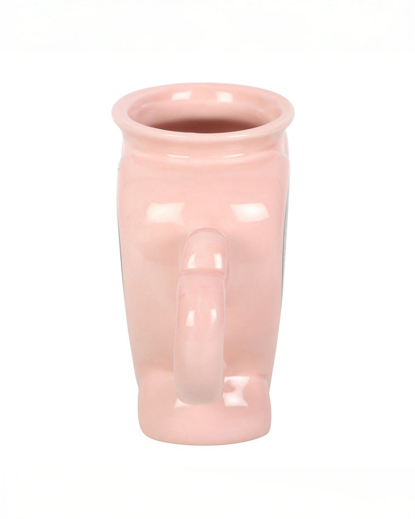 Side view of the Rebel Romance Love Potion Shaped Mug in soft pink ceramic, showing the unique sculpted shape and heart handle. A fun gothic homeware item perfect for alternative style lovers.