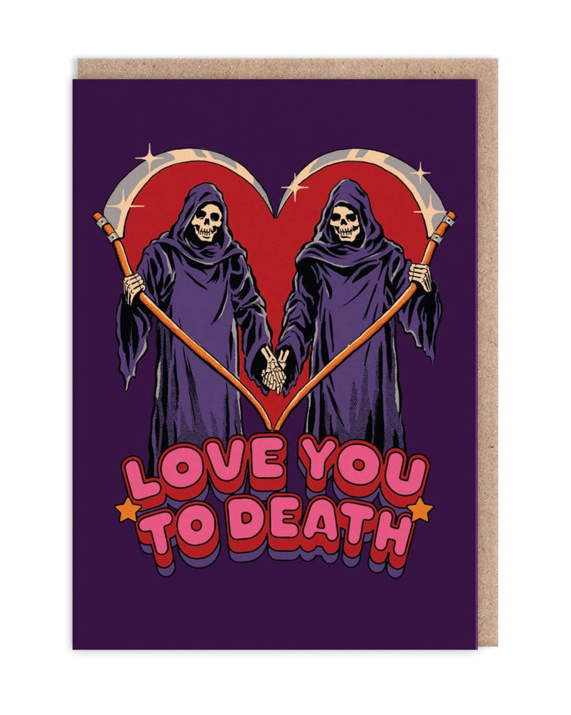 Love You to Death
Playful and gothic-themed greeting card showing two grim reapers holding hands with scythes forming a heart shape above them. The text reads, “Love You to Death,” in bold pink letters, set against a dark purple background.