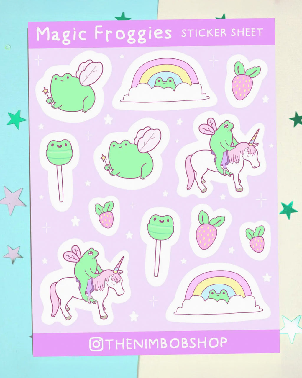 Magic Froggies Sticker Sheet by Nimbob, sold by Rebel Romance. A pastel purple sticker sheet with cute hand-drawn green frogs with fairy wings, frogs riding unicorns, frog-face lollipops, pink strawberries, and rainbows. Whimsical, colourful and perfect for millennial lovers of cottagecore, dopamine dressing and quirky stationery.