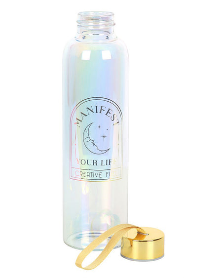 The Manifest Your Life iridescent water bottle with its gold lid and yellow loop removed, showing the wide opening for easy filling. The glass reflects pastel pinks, blues, and purples, adding to its magical aesthetic.