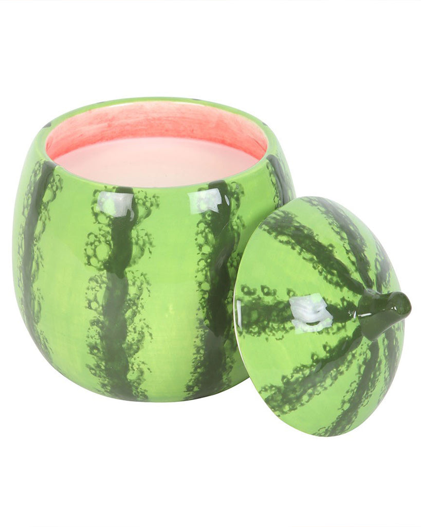 A ceramic watermelon-shaped candle jar with the lid placed beside it. The realistic watermelon rind texture and vibrant red interior create a fun and summery aesthetic.