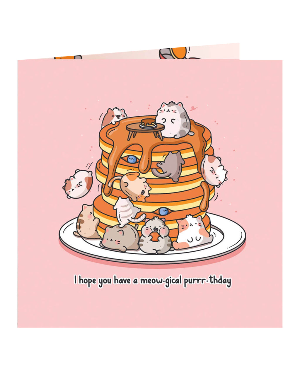Close-up of a square pink birthday card with cute illustrated cats on a pancake stack and the pun “I hope you have a meow-gical purrr-thday.” Ideal for cat lovers. Designed by Toastedink and stocked by Rebel Romance, a UK brand for quirky, nostalgic gifts.