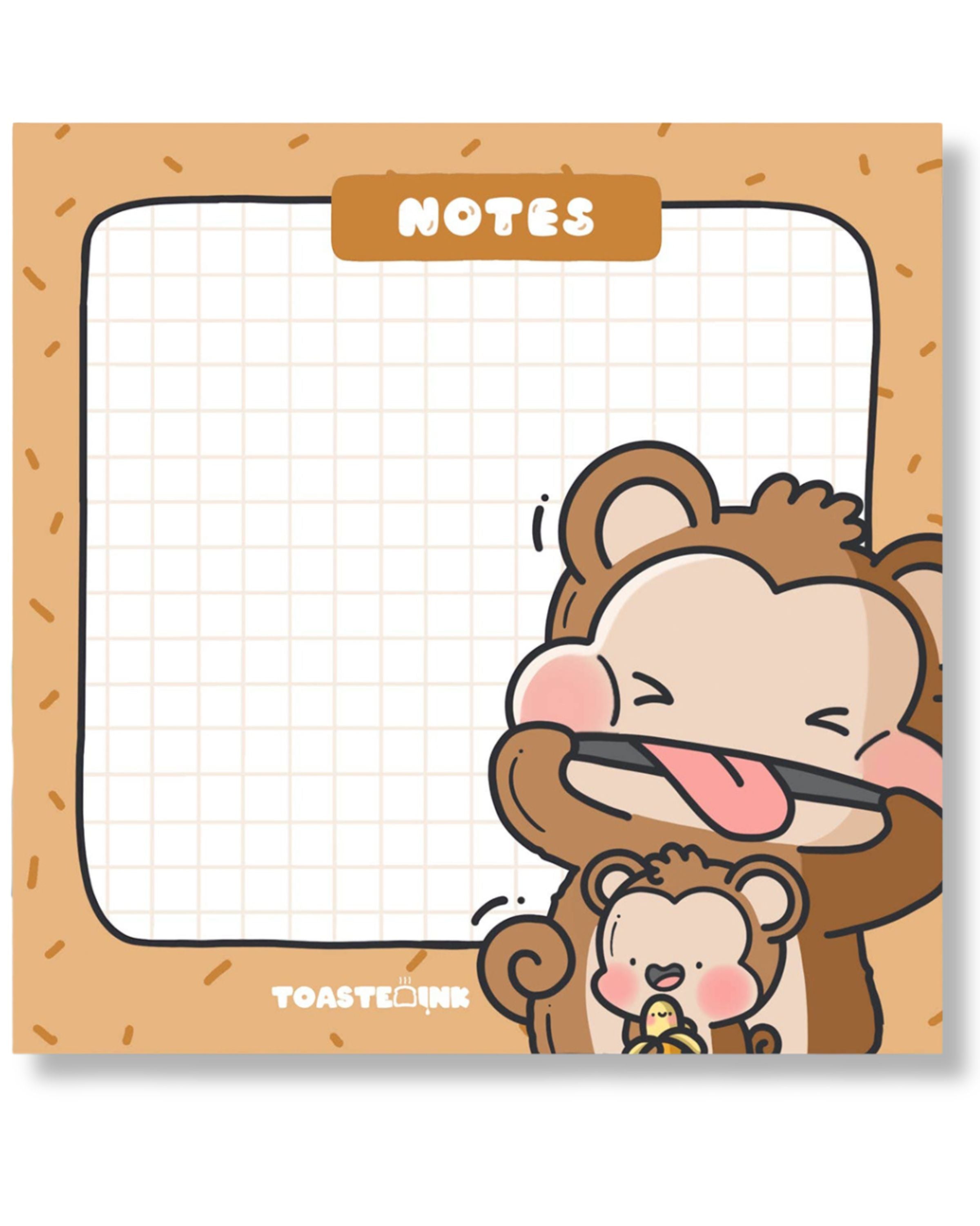 Flat lay of Toastedink monkey sticky notes on a blue background with a pink pen. Features cheeky cartoon monkeys and a gridded note space. Available at Rebel Romance, a UK indie store for whimsical and retro stationery lovers.