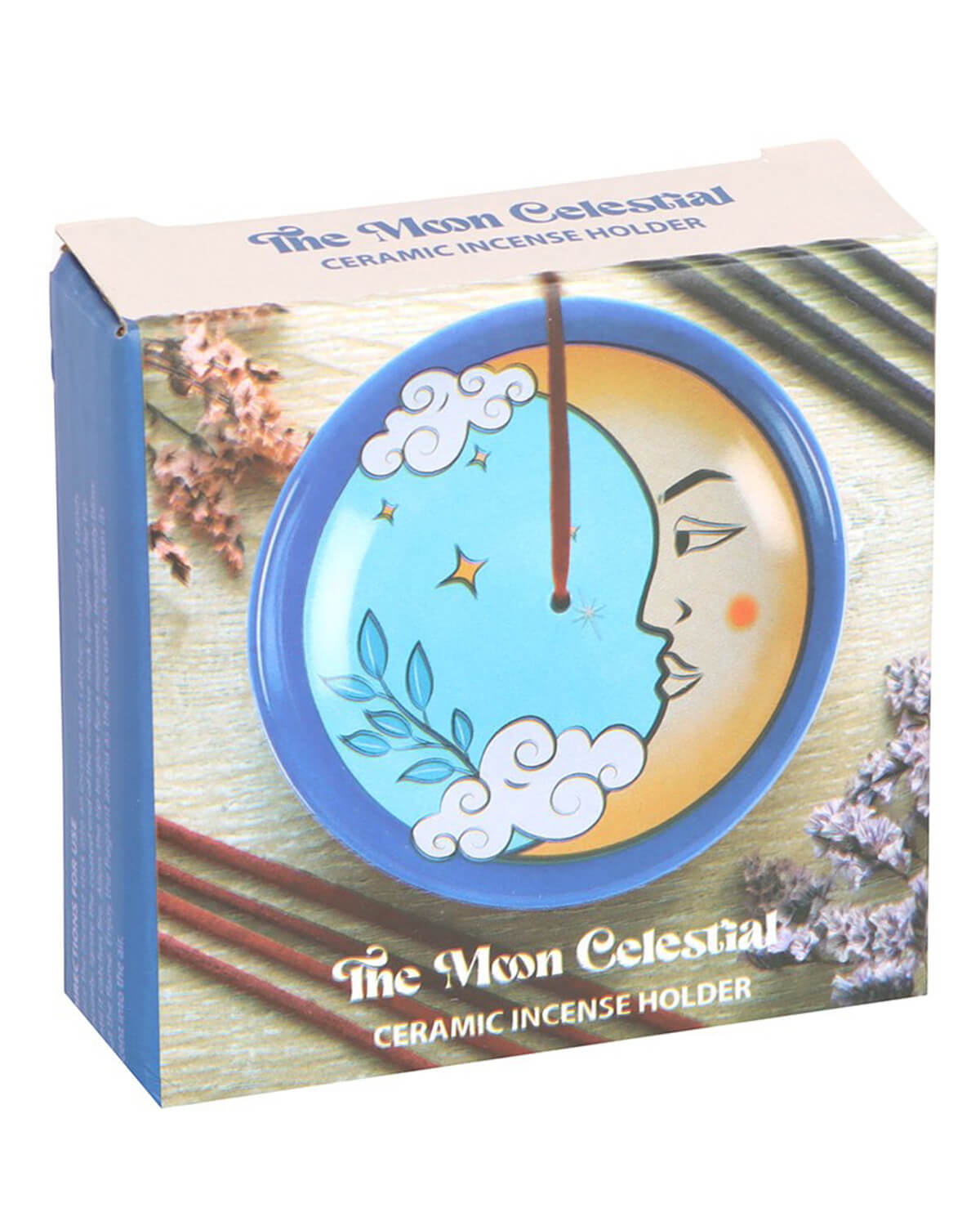 The incense holder in its packaging, with a clear window showing the moon design, surrounded by decorative elements.
