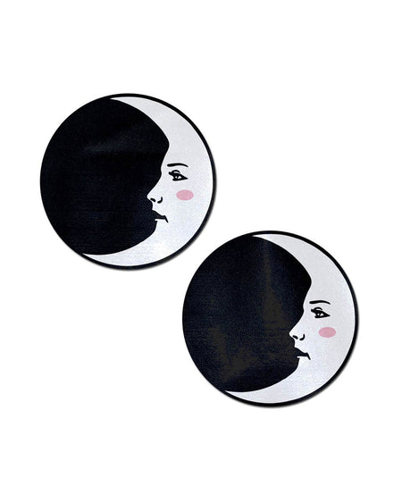 Moon: Black and White Man in the Moon Nipple Pasties by Pastease. Two crescent moon with pink blush on black circle nipple covers on a white background. Perfect for a festival, pride, burlesque performance, only fans content or a party.