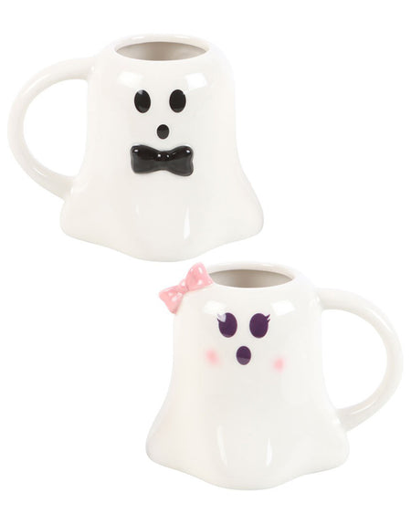 A spooky yet adorable set of ghost-shaped mugs from the Mr and Mrs Boo collection from Rebel Romance. One mug features a black bow tie and a surprised ghostly expression, while the other has a pink polka-dotted bow and cute blushing cheeks, making them a perfect Halloween or wedding gift.