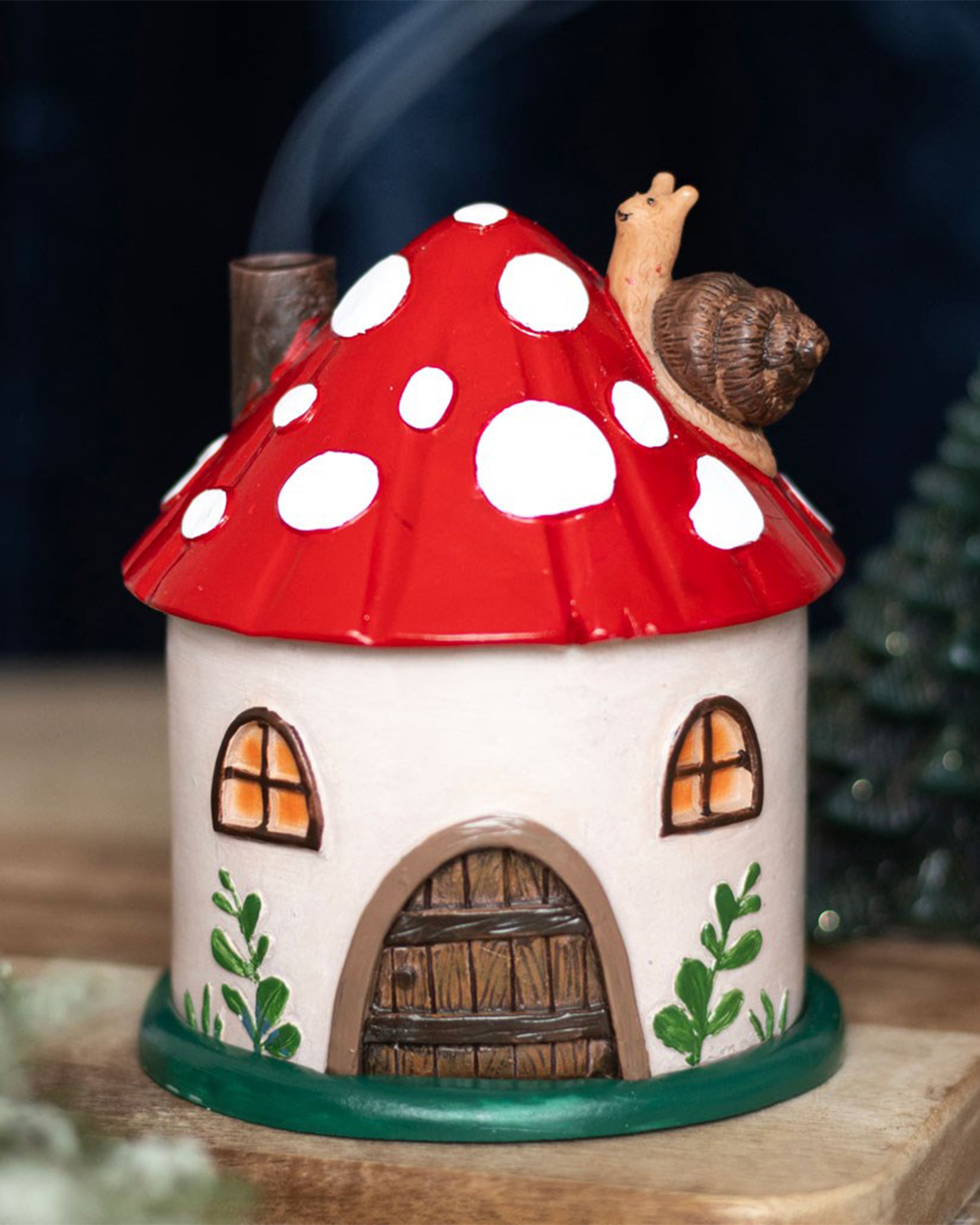 The mushroom house incense burner in use, with scented smoke flowing from its chimney. Creates a magical fairytale vibe. Sold by Rebel Romance, a UK alternative lifestyle brand for magical millennials.