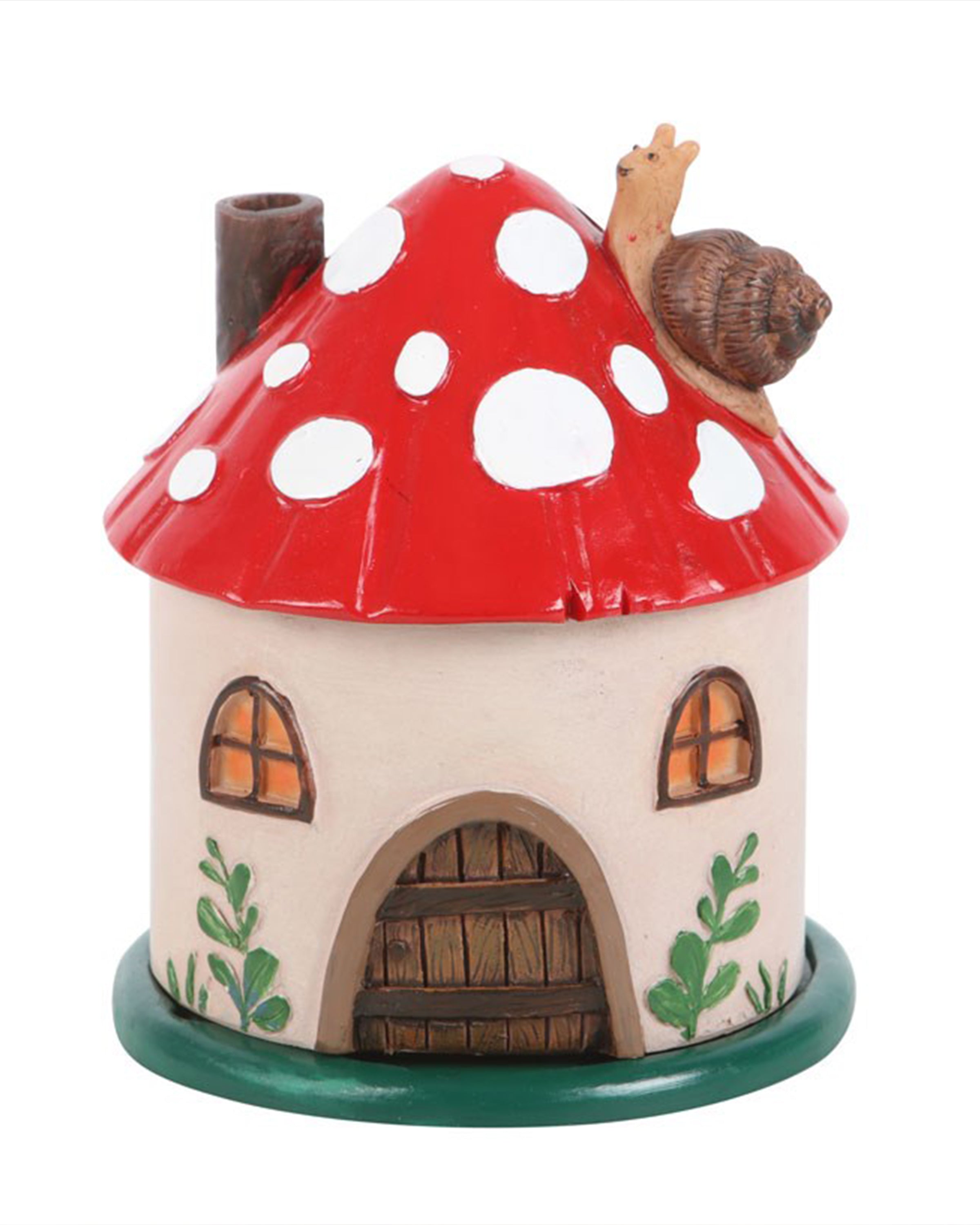 Front view of the Mushroom House Incense Cone Burner with glowing painted windows, green vines, and a wooden-look door. A sweet snail figure sits on top of the toadstool roof. Sold by Rebel Romance.