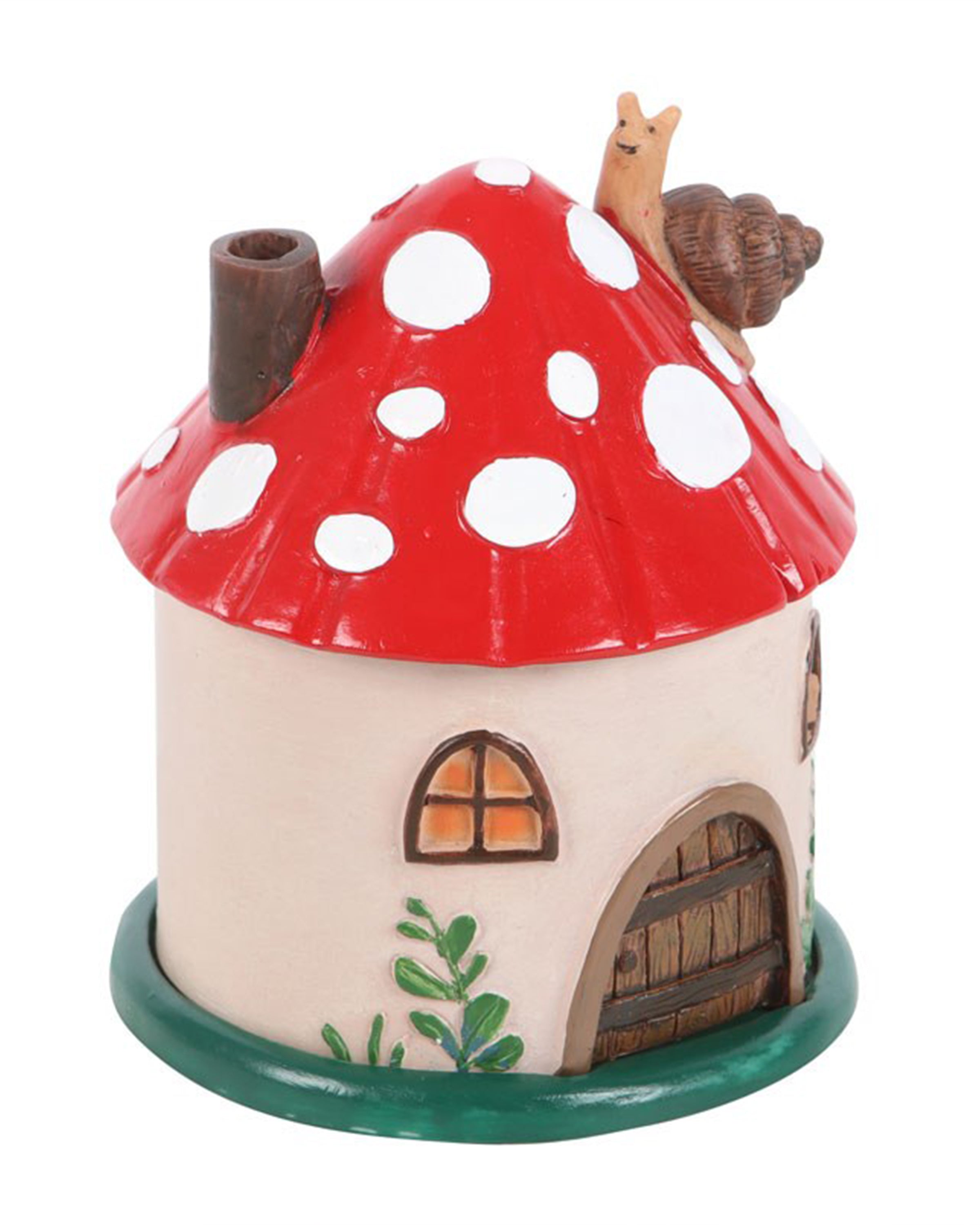 Side view of the red mushroom house incense burner with two arched windows, leafy green details, and a brown chimney. Features a happy snail on the roof. Available from Rebel Romance.