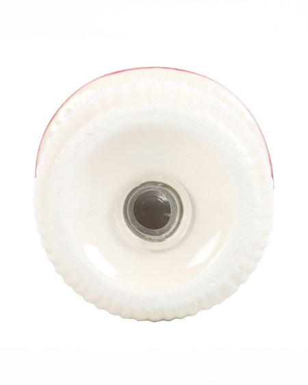 Base view of one ceramic mushroom shaker from Rebel Romance, showing the refillable stopper underneath for easy refilling of salt or pepper.