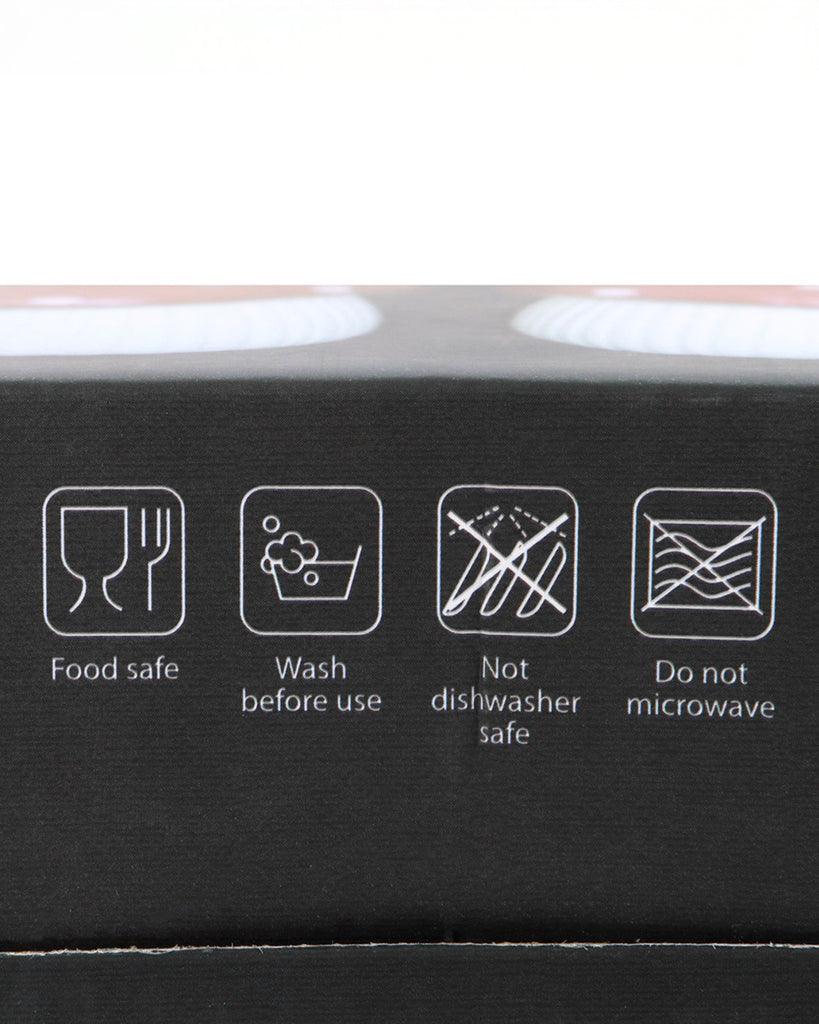 Close-up of icons on the packaging of the Mushroom Salt & Pepper Shaker Set by Rebel Romance, showing care instructions: food safe, wash before use, not dishwasher safe, and do not microwave.