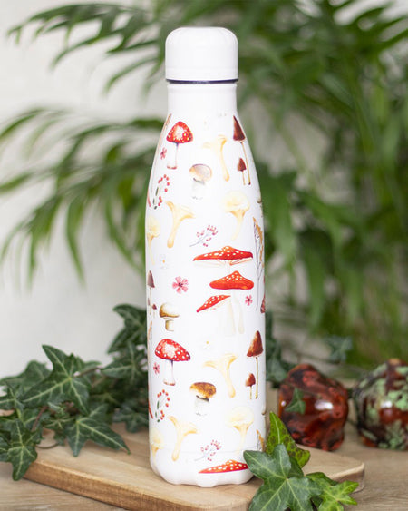 A close-up of the Rebel Romance Mushroom Print Metal Water Bottle. The white background is decorated with vibrant red toadstools, golden chanterelles, and woodland florals, perfect for nature lovers and forest-core aesthetics.