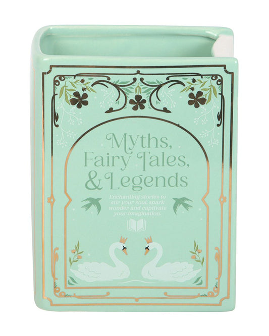 Close-up of the Rebel Romance Myths, Fairy Tales & Legends Green Book Shaped Vase. This ceramic book-shaped vase features elegant swan and floral illustrations with gold detailing, making it a magical homeware gift for readers and fantasy lovers.