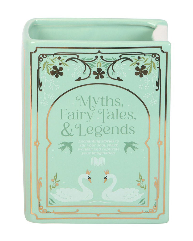 Close-up of the Rebel Romance Myths, Fairy Tales & Legends Green Book Shaped Vase. This ceramic book-shaped vase features elegant swan and floral illustrations with gold detailing, making it a magical homeware gift for readers and fantasy lovers.