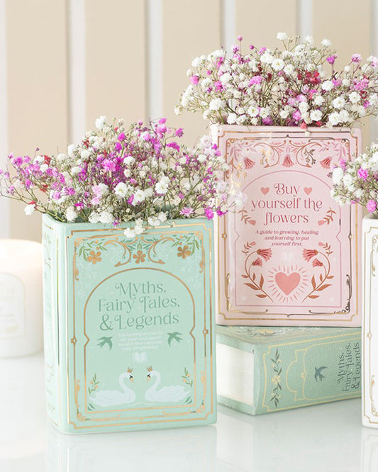 Rebel Romance Myths, Fairy Tales & Legends Green Book Shaped Vase styled with pink and white gypsophila flowers. A whimsical ceramic vase designed like an upright book, perfect for book lovers and alternative home décor. Ideal for adding charm to shelves, desks, or cosy reading nooks.