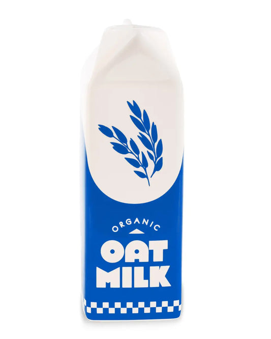 Blue and white ceramic vase shaped like an oat milk carton with bold text that reads "Organic Oat Milk" and a blue oat illustration on the front. Designed by Rebel Romance, a small UK business celebrating alternative aesthetics with quirky homeware and gifts for millennials.