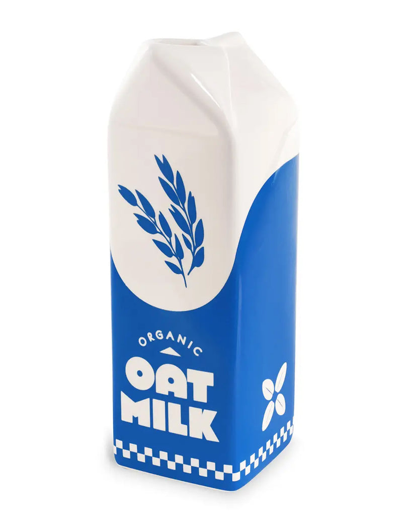 Side angle view of a ceramic oat milk vase with a blue and white design, featuring a retro-style "Organic Oat Milk" label and oat graphic. A playful home decor item by Rebel Romance, a UK-based brand known for unique, alternative gifts and style.