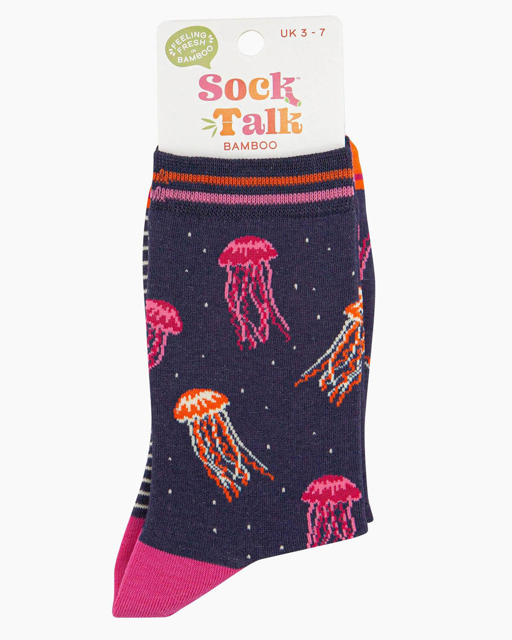 (Packaged Socks): A folded pair of navy bamboo jellyfish socks inside their Sock Talk bamboo packaging, featuring bright pink and orange jellyfish designs with small dotted details resembling bubbles. The packaging states a UK 3-7 size range.