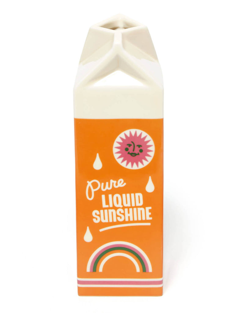Front view of Rise and Shine Vase – Orange Juice Edition by Ban.do – A ceramic vase shaped like a vintage orange juice carton, featuring bold orange and cream colours with retro typography and cute citrus illustrations.