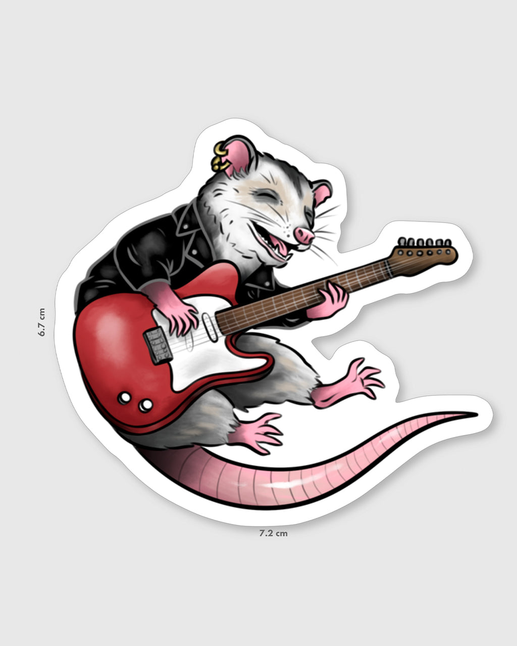 Vinyl sticker of a grinning opossum wearing a black leather jacket and gold earring, playing a red electric guitar. The opossum has pink paws, a curled tail, and joyful expression. Design by Rebel Romance, set against a pale background with dimensions 7.2 cm x 6.7 cm shown.