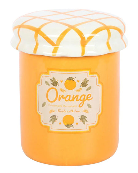 A full view of the orange marmalade oil burner with the lid on. The vibrant orange colour and realistic jam jar design make it a charming decorative piece.