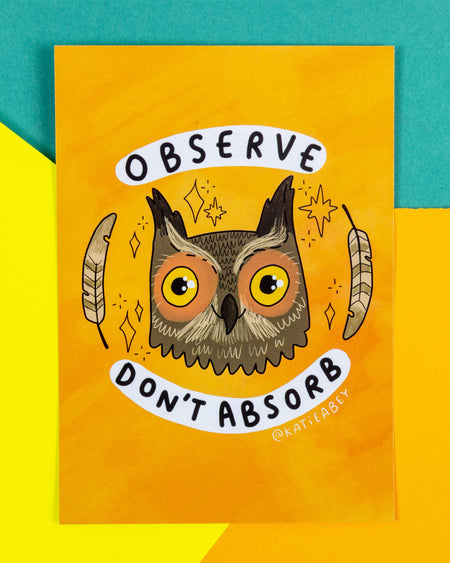 A bright yellow A6 postcard by Katie Abey, sold by Rebel Romance, a UK brand for quirky and alternative gifts. The design features a wide-eyed owl with orange eyes and cute feather details, surrounded by sparkles and feathers. Above and below the owl are the words: “Observe Don’t Absorb.” A calming and wise reminder for sensitive souls, this motivational postcard is perfect for animal lovers and mindfulness fans.