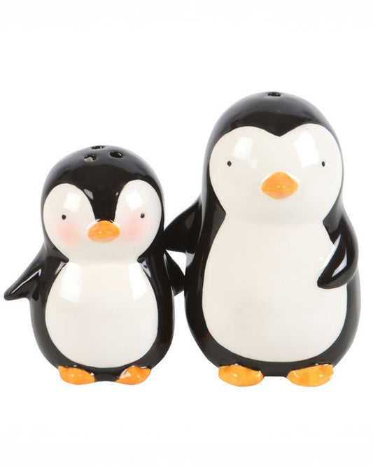 Clear front-facing image of the hugging penguins salt and pepper shakers with their flippers tucked around each other, perfect for Christmas table styling.