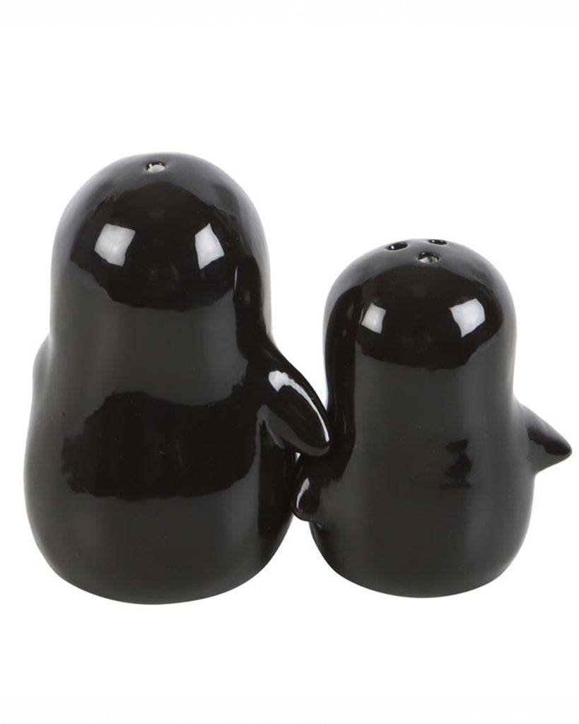 Back view of the hugging penguin salt and pepper shakers showing their glossy black finish and connected hugging flippers.