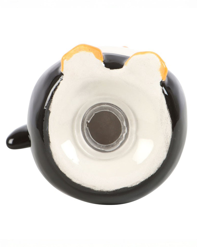 Bottom of one of the penguin salt and pepper shakers showing the refillable stopper and ceramic glaze detail.