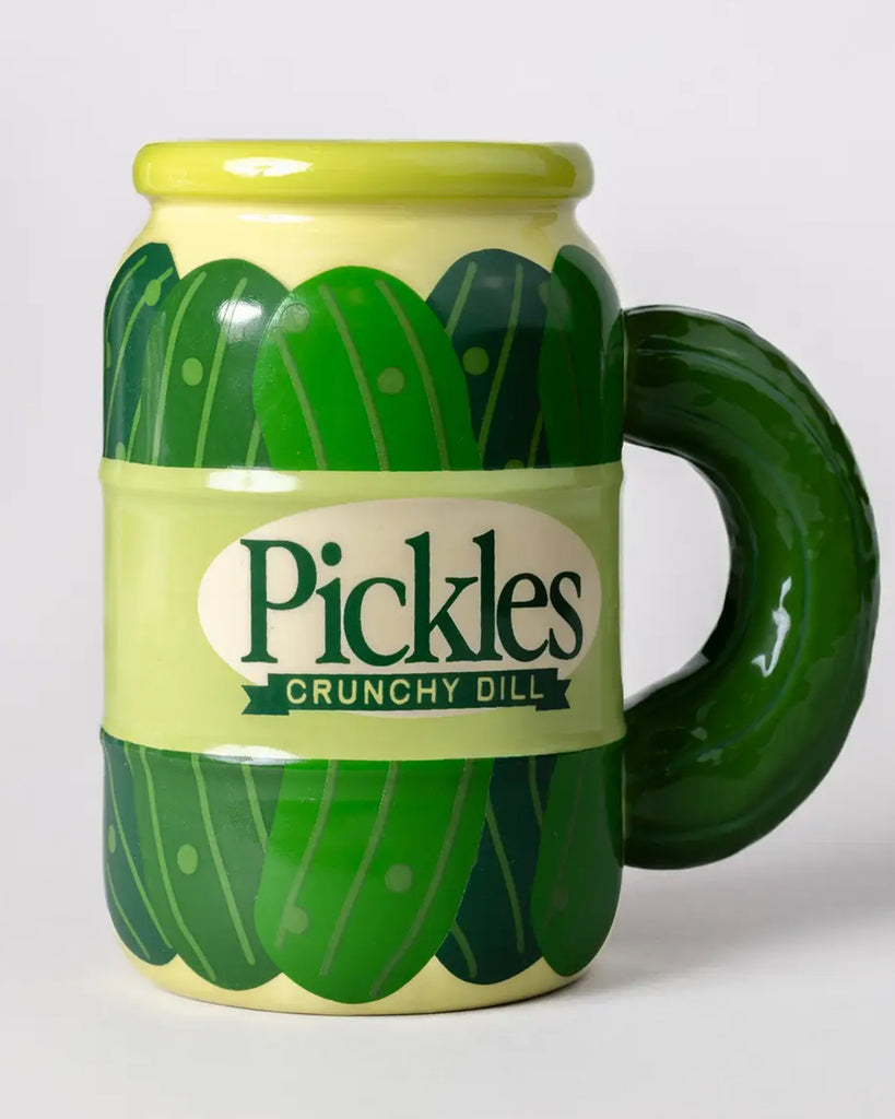 Angled front view of the pickle jar mug by Rebel Romance, showing vibrant green pickle patterns and the bold "Pickles Crunchy Dill" label. A must-have for anyone who loves fun, foodie-themed mugs.