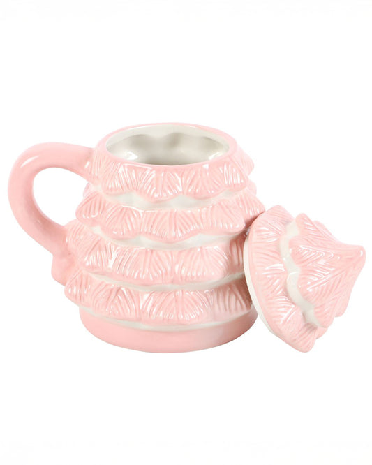 Side view of the Rebel Romance Pink Christmas Tree Mug with the lid removed and placed beside it. The inside of the ceramic mug is smooth and white, perfect for serving festive drinks like hot chocolate or spiced lattes.
