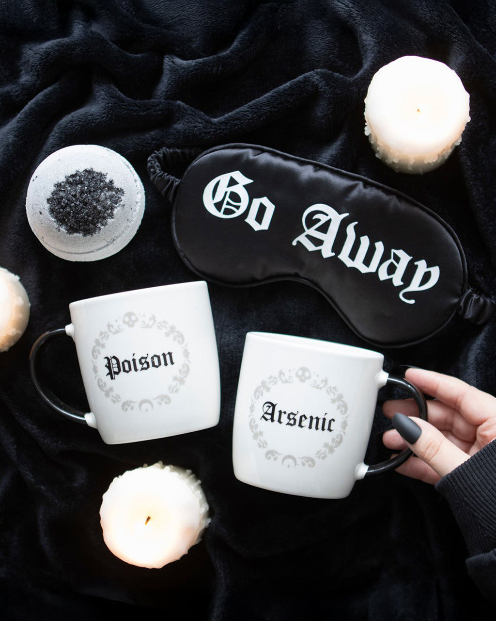 A flat lay featuring the Poison and Arsenic Mugs, surrounded by gothic accessories including a 