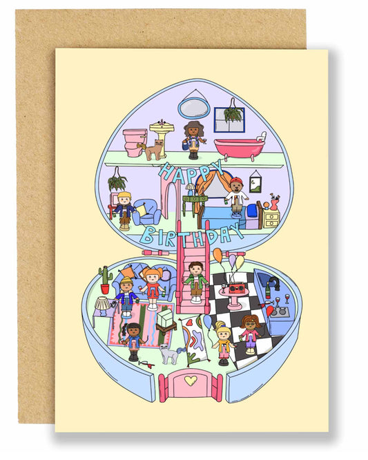 Illustrated birthday card by Eat The Moon featuring a nostalgic Polly Pocket–style house with multiple rooms, tiny characters celebrating a birthday with balloons, banners, and gifts. The card is paired with a brown Kraft envelope and has a playful, colourful design.
