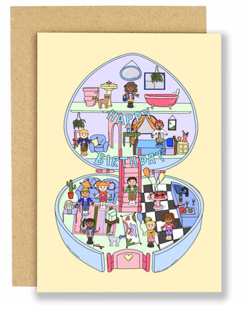 Illustrated birthday card by Eat The Moon featuring a nostalgic Polly Pocket–style house with multiple rooms, tiny characters celebrating a birthday with balloons, banners, and gifts. The card is paired with a brown Kraft envelope and has a playful, colourful design.