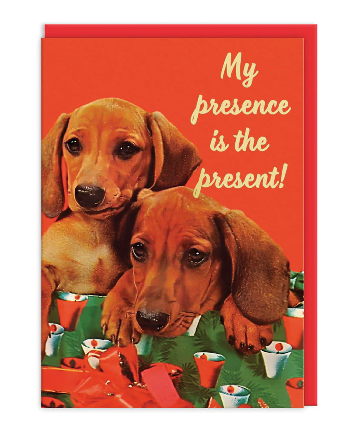 Retro-style sausage dog greeting card with two dachshund puppies sitting on festive wrapping paper and gifts, with the slogan 