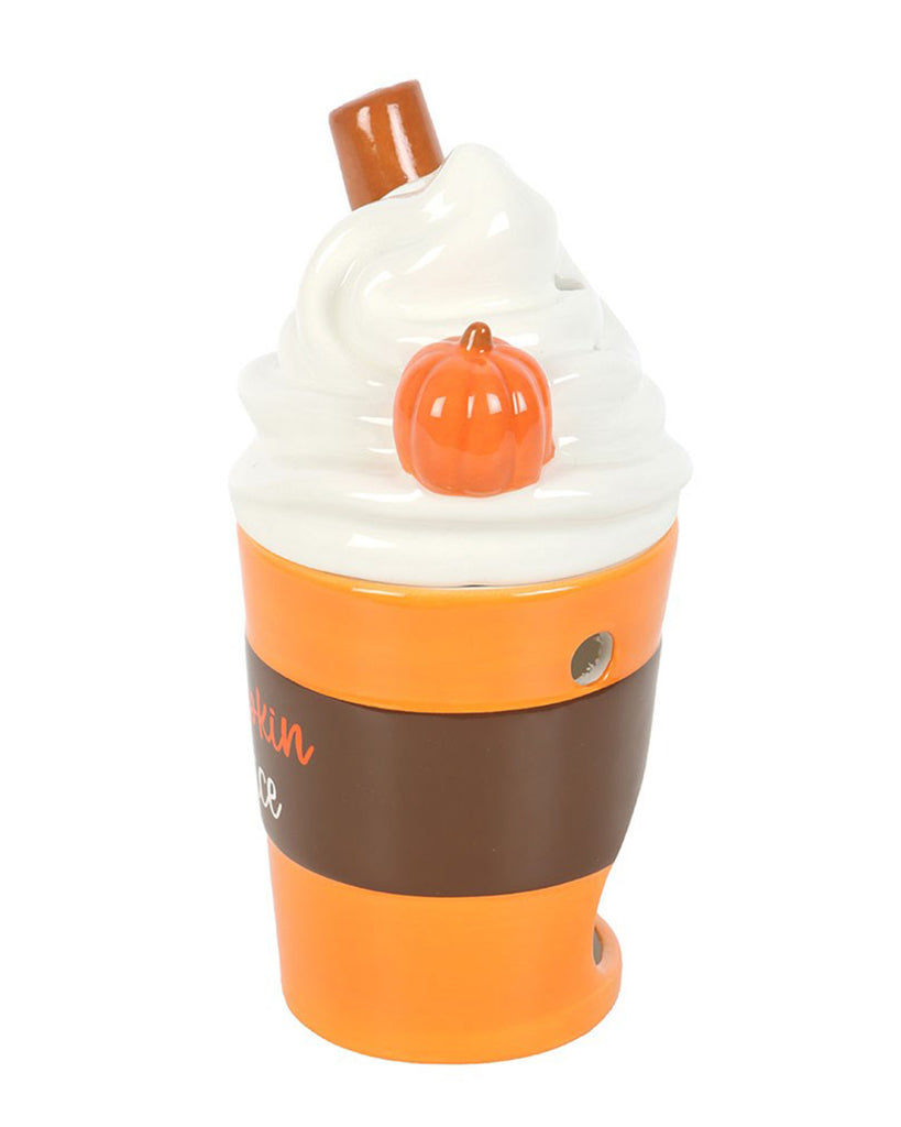 Side view of the Rebel Romance ceramic pumpkin spice latte oil burner, showing the swirl cream lid with cinnamon stick and pumpkin detail. The cup has an autumnal orange and brown design.
