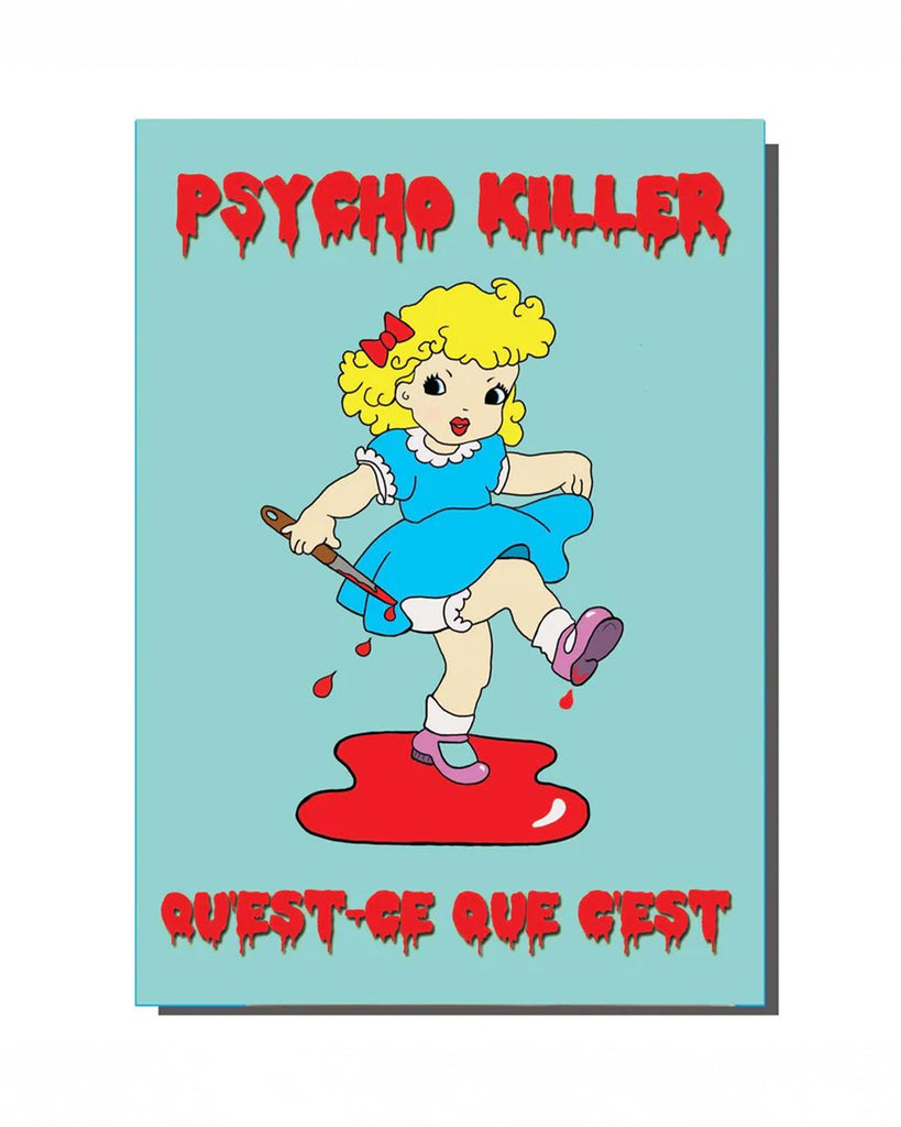 A retro-inspired A6 greeting card featuring a kitschy cartoon girl in a blue dress holding a bloody knife, standing in a pool of red. The words "PSYCHO KILLER" and "QUEST-CE QUE C'EST" are written in bold, dripping red horror-style text. A quirky and darkly humorous design from Rebel Romance, a UK-based alternative brand known for embracing the weird and wonderful.