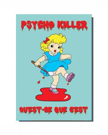 A retro-inspired A6 greeting card featuring a kitschy cartoon girl in a blue dress holding a bloody knife, standing in a pool of red. The words "PSYCHO KILLER" and "QUEST-CE QUE C'EST" are written in bold, dripping red horror-style text. A quirky and darkly humorous design from Rebel Romance, a UK-based alternative brand known for embracing the weird and wonderful.