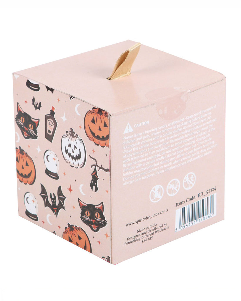 The back of the Pumpkin Carving candle’s packaging, adorned with vintage Halloween illustrations like black cats, pumpkins, and crystal balls, along with product safety details.
