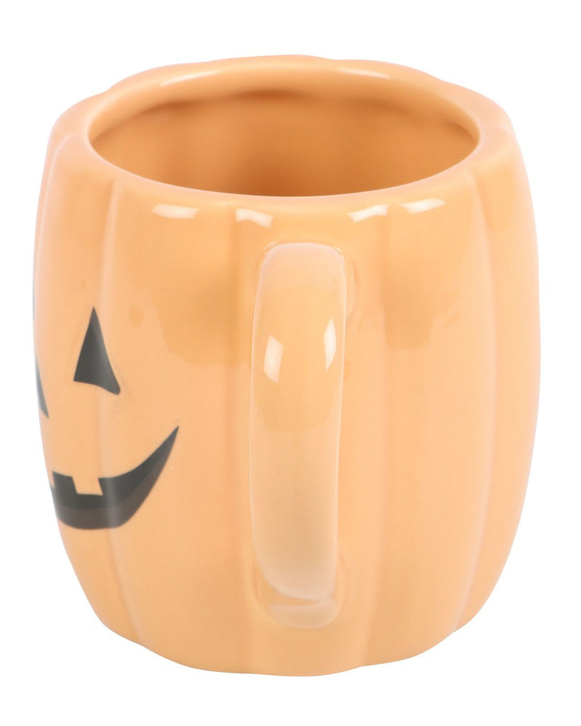 Back view of the mug with the handle visible and part of the jack-o'-lantern face showing on the side.