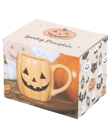 Spooky Pumpkin Ceramic Mug in Halloween-themed packaging with bats, pumpkins, ghosts and potion bottles, ideal for gifting.